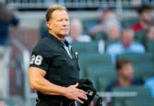 Umpire Jim Wolf exits Royals-Mariners after foul ball off mask