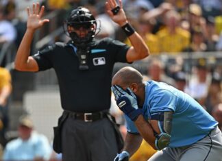 Tampa Bay Rays 3B Amed Rosario exits after being hit in head