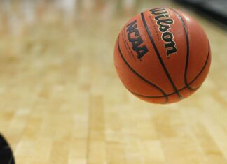 USF has named an interim coach following the death of Amir Abdur-Rahim