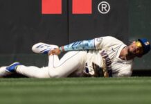 Mariners’ Julio Rodriguez sprains ankle after crashing into fence