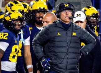 Jim Harbaugh stepped down as Michigan’s honorary captain for the opener