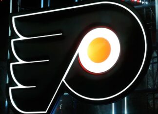 Guy Gaudreau, father of John and Matthew, helps out at Flyers practice