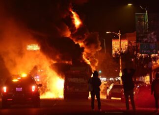 12 arrested, L.A. bus set on fire following World Series win